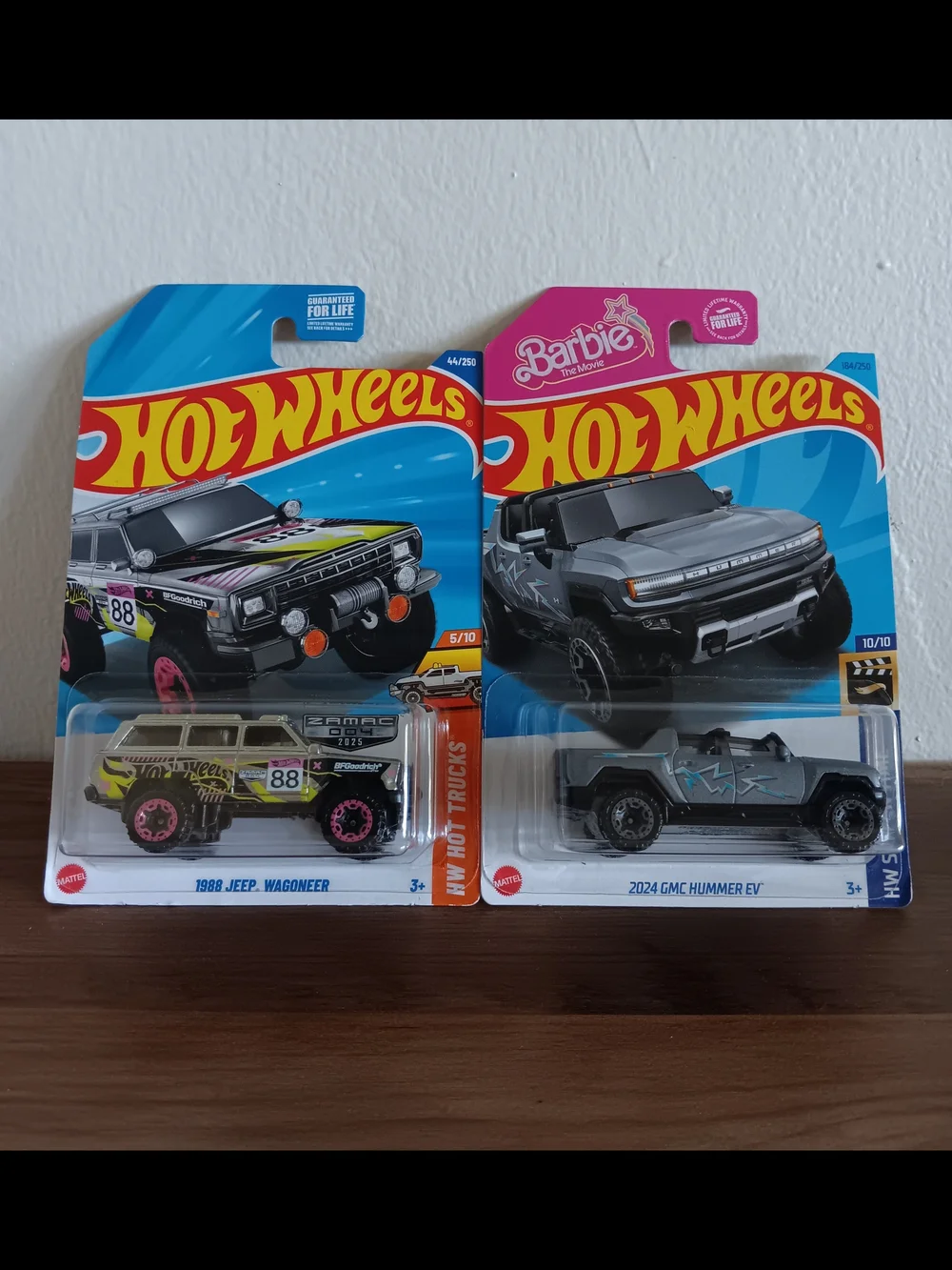 Hot Wheels 1988 Jeep Wagoneer & 2024 GMC Hummer EV Lot Of 2